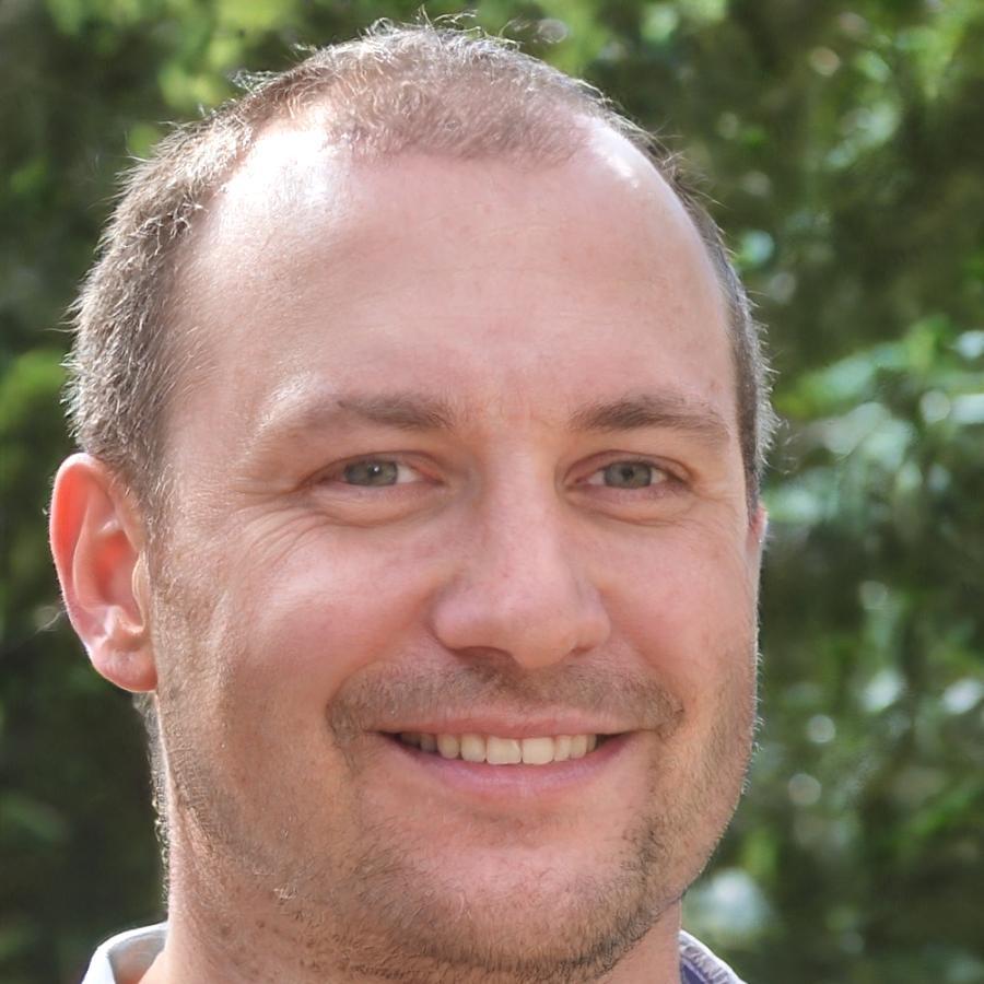 Professional headshot of market psychology and risk management specialist