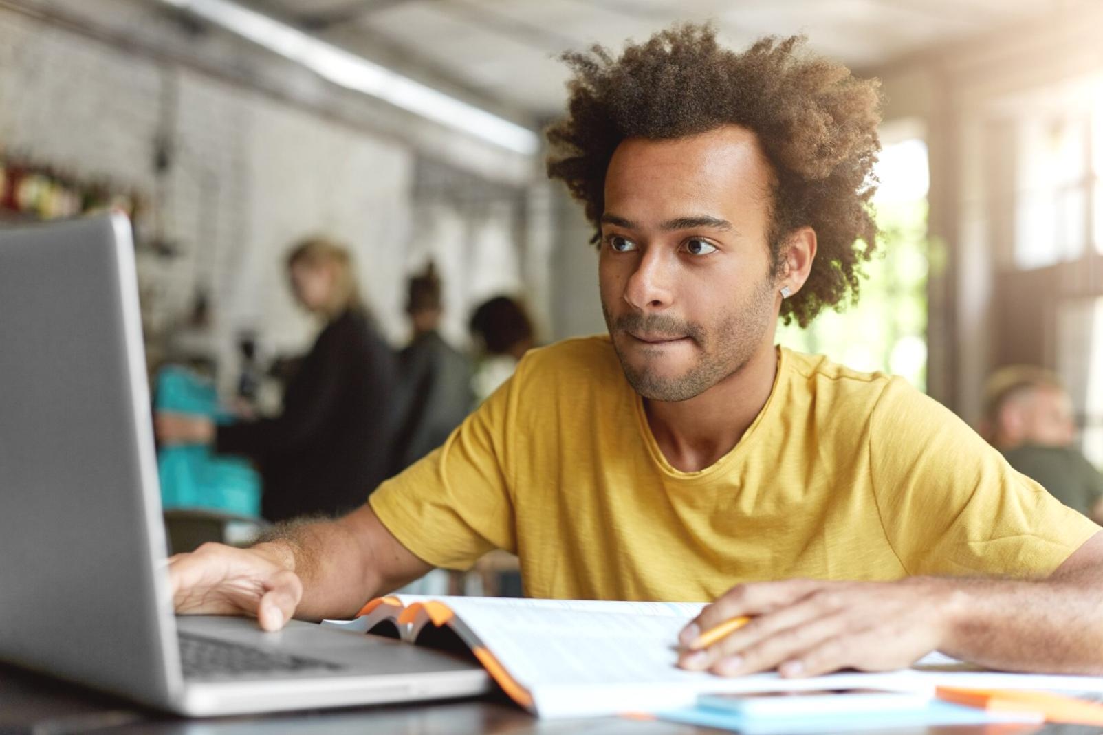 Modern trading education classroom with students learning technical analysis on computer screens